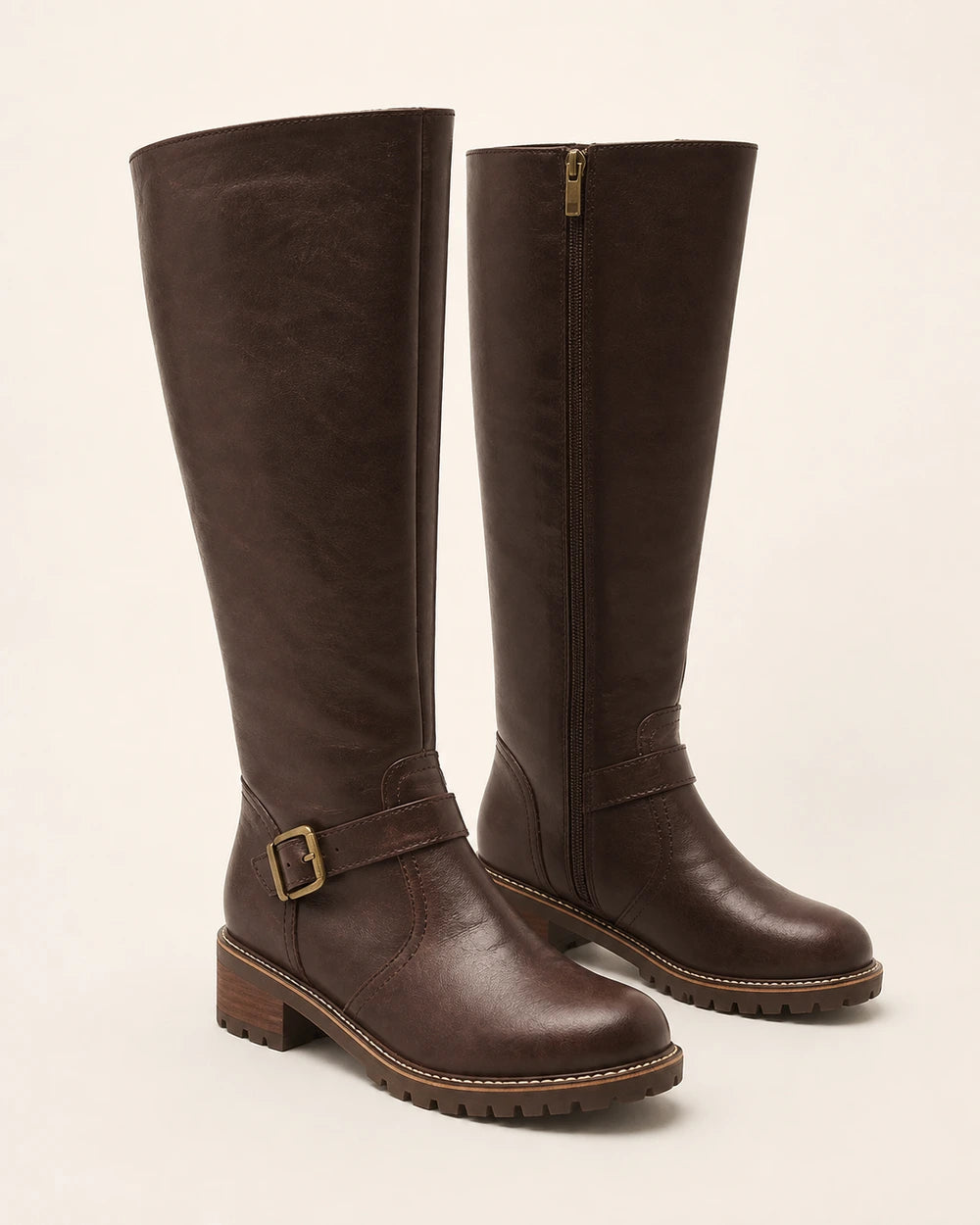 Women's dark brown buckle-strap knee-high riding boots, product-only pair.