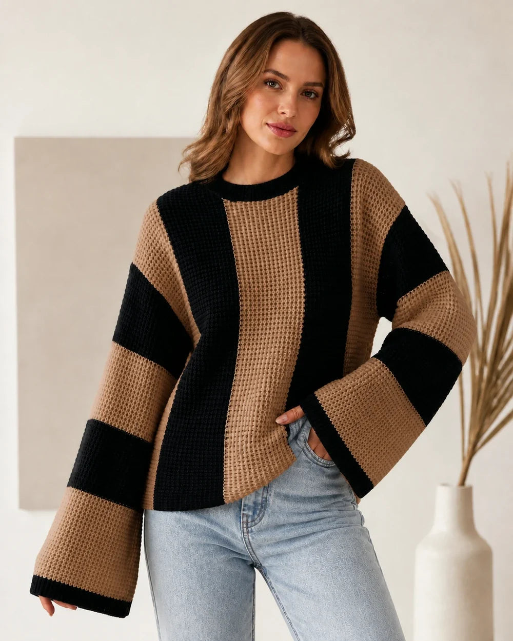 Women's brown black-and-camel color-block sweater, worn front view