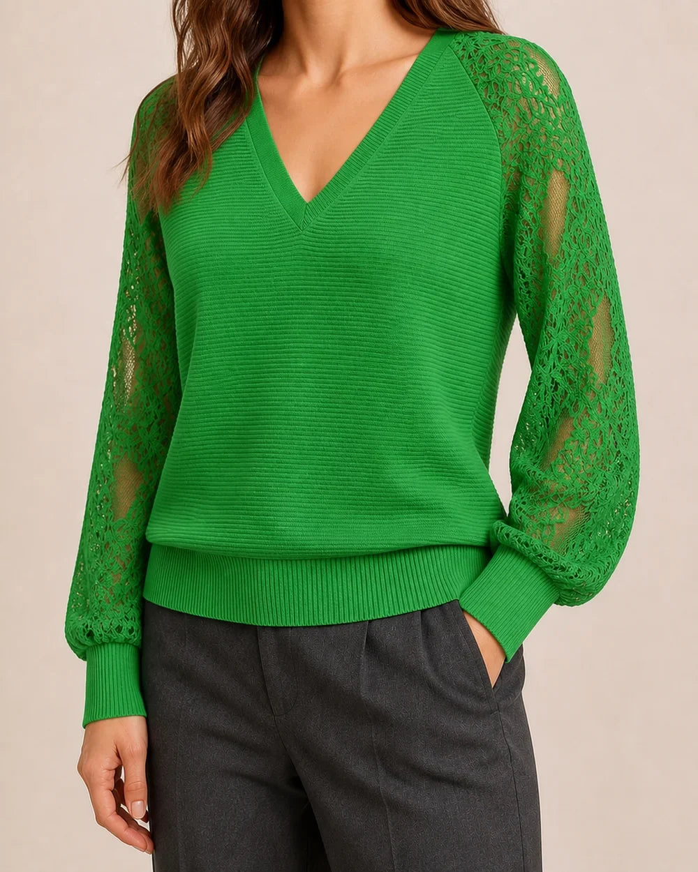 Women's Clover Green ribbed V-neck sweater with floral lace sleeves, worn hero view.