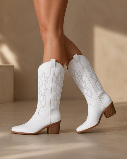Exact plain white embroidered Western knee-high boots, walking view.
