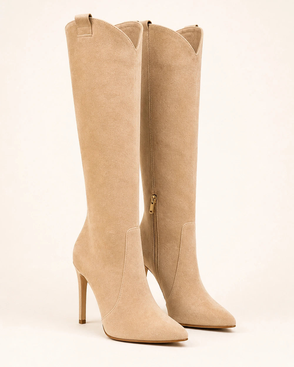 Women's beige suede pointed-toe knee-high boots with a high stiletto heel.