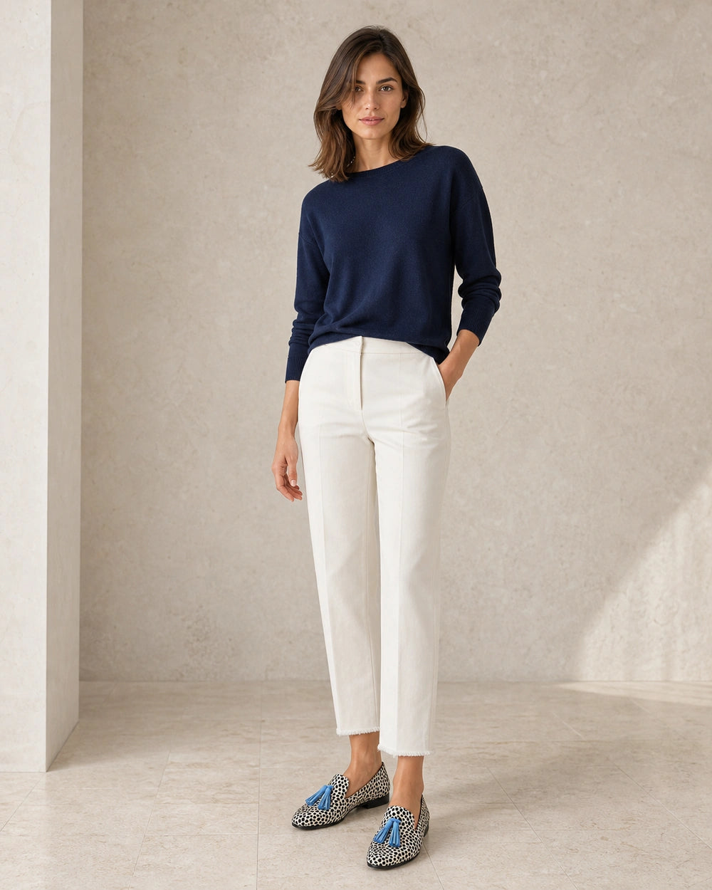 Women's Animal-Print Loafers with Blue Tassels — worn by a model