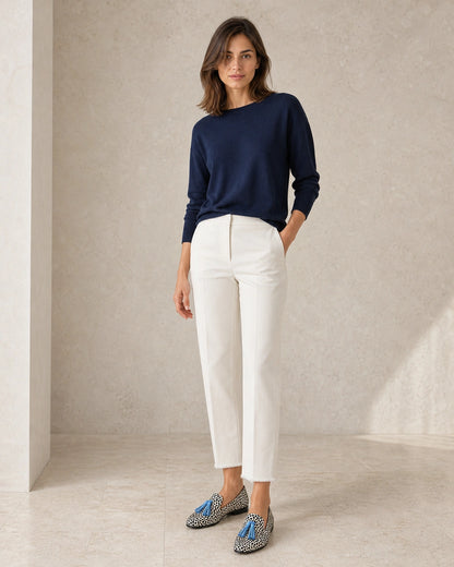 Women's Animal-Print Loafers with Blue Tassels — worn by a model