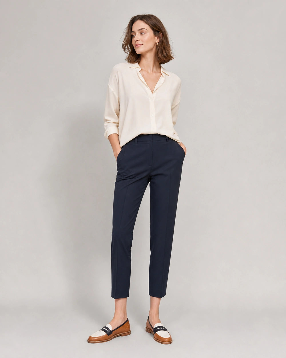 Women's Brown and Cream Round-Toe Loafers — worn by a model