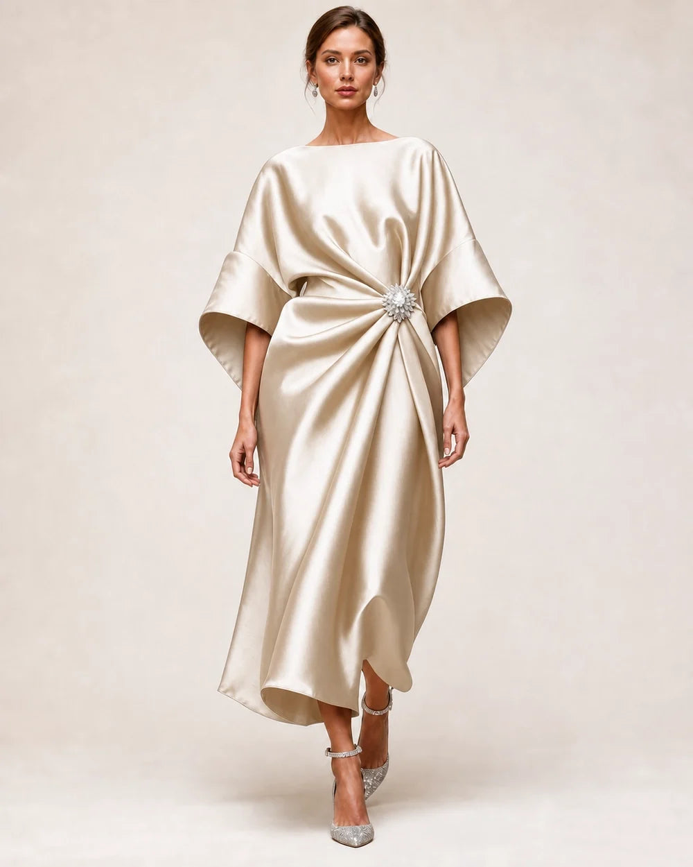Women's light khaki satin midi dress with draped waist, crystal flower brooch and wide batwing sleeves.