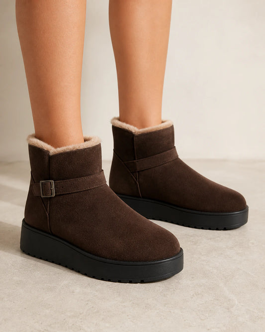 Women's chocolate brown faux-fur platform ankle boots, front three-quarter view.