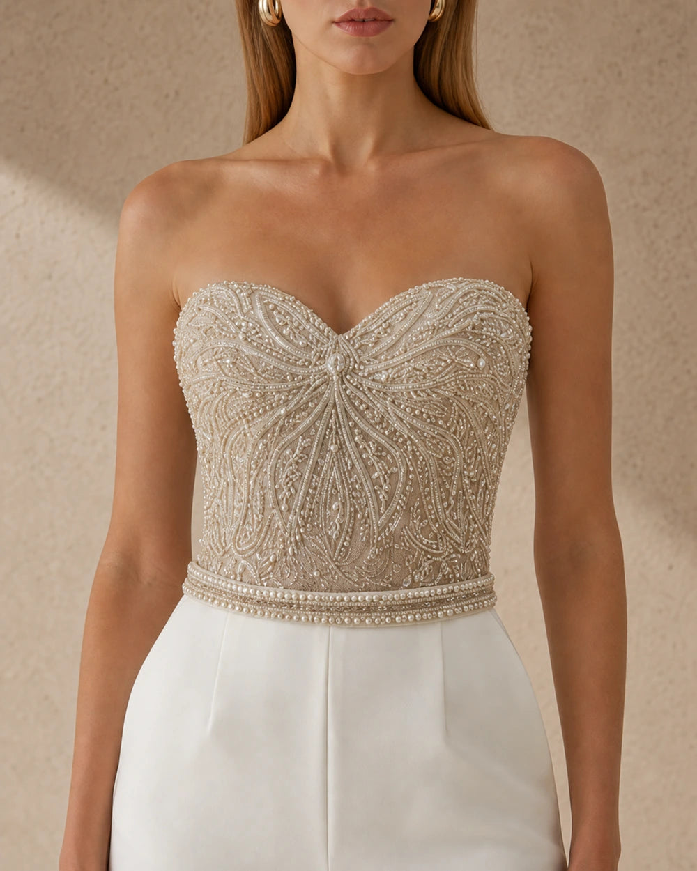 Women's white strapless tailored jumpsuit, bodice detail. — womens-strapless-tailored-occasion-jumpsuit-white-05-bodice-detail.webp