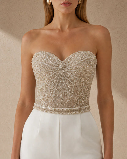 Women's white strapless tailored jumpsuit, bodice detail. — womens-strapless-tailored-occasion-jumpsuit-white-05-bodice-detail.webp